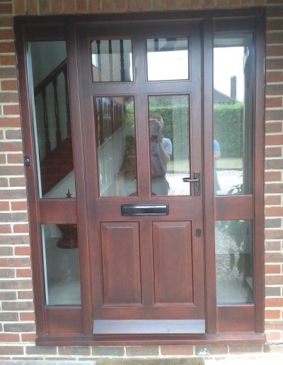 brown timber front door with edges